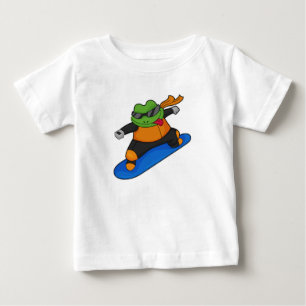 T-shirt Pour Bébé Grenouille en snowobarder avec snowboard