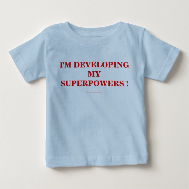 T-SHIRT POUR BÉBÉ JE DÉVELOPPE MES SUPERPUISSANCES ! (Devant)