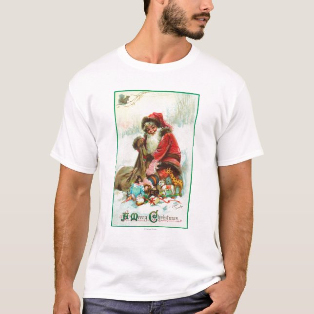 T-shirt Un Joyeux Noël Père Noël emballant des jouets dans (Devant)