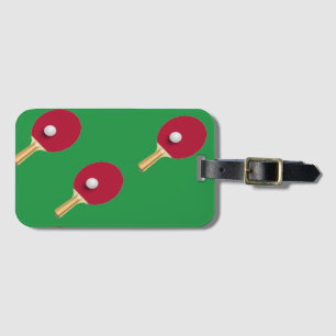Table tennis racket and ball on green luggage tag