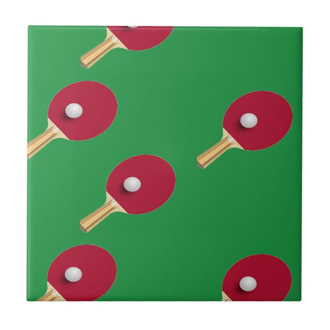 Table tennis racket and ball on green tile (Front)