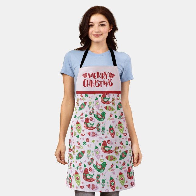 Tablier Art populaire scandinave rose et rouge Joyeux Noël (Porté)