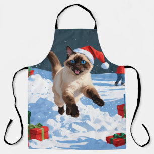 Tablier Chat siamois courant dans la neige avec un chapeau