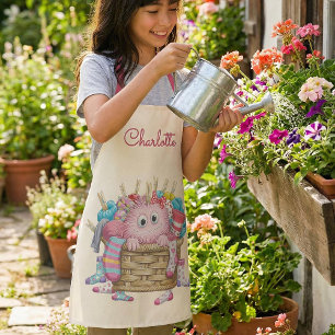 Tablier Conception de monstre de chaussette rose mignon et