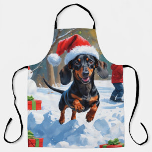 Tablier Dachshund courant dans la neige avec un chapeau de