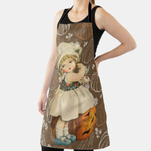 Tablier Fille sculptant une pomme Halloween