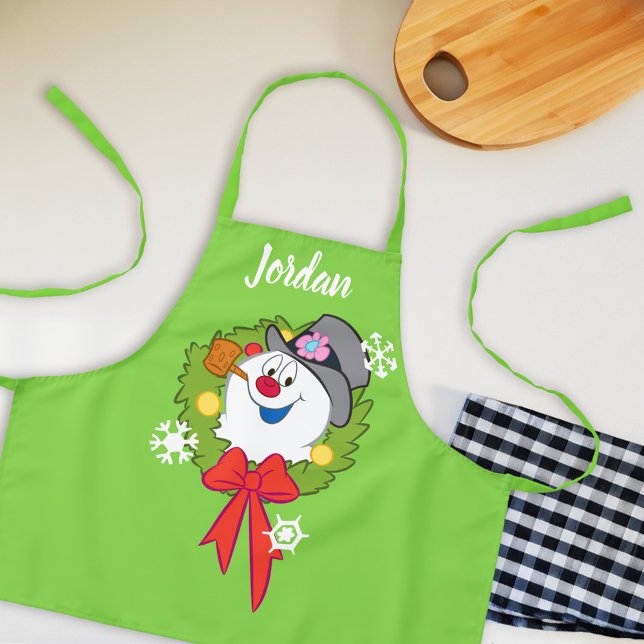 Tablier Frosty the Snowman™ | Crème Frosty Holiday (Apron on counter)