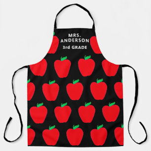 Tablier Les pommes rouges de l'enseignant sur le noir pers