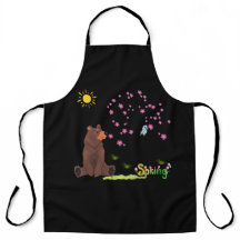 L'ours observe l'arbre en fleurs et l'oiseau