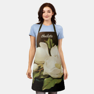 Tablier Magnolias géants sur une étoffe de velours bleu pa