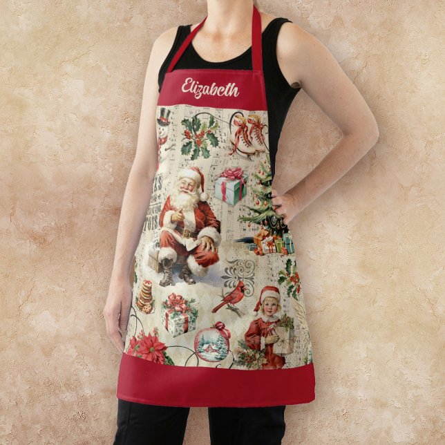 Tablier Noël du Père Noël vintage (A festive vintage Christmas apron with Santa Claus and other Christmas holiday embellishments.)