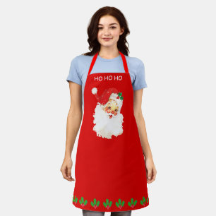 Tablier Père Noël vintage et feuilles de houx sur fond rou