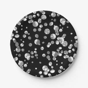 Taches dorées sur fond noir. assiette en papier