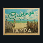 Tampa Beach Vintage Travel Postcard<br><div class="desc">This Greetings From Tampa vintage postcard design features a sandy beach with a beautiful turquoise ocean water and above the sea,  a blue sky with billowy white clouds. In vintage travels style.</div>