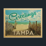 Tampa Beach Vintage Travel Postcard<br><div class="desc">This Greetings From Tampa vintage postcard design features a sandy beach with a beautiful turquoise ocean water and above the sea,  a blue sky with billowy white clouds. In vintage travels style.</div>