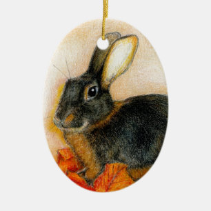 TAN AND BLACK CERAMIC ORNAMENT