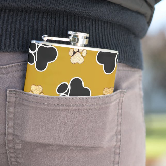 Tan and black paw print on a gold background #2 hip flask (In Situ)