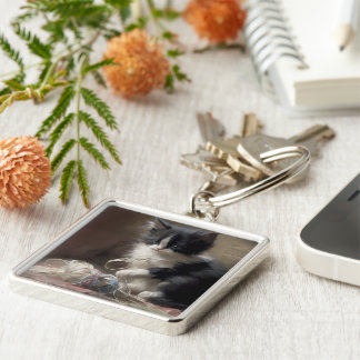 Tangled Up In Fun Black and White Kitten Keychain