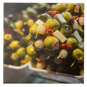 Tapas made with stuffed olives tile