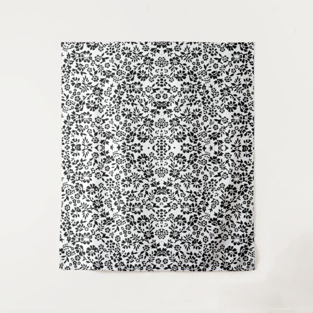 Tapestry blanket with a black and white flowers. (Front)