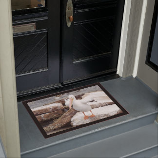 Tapis de porte courageux de pélican