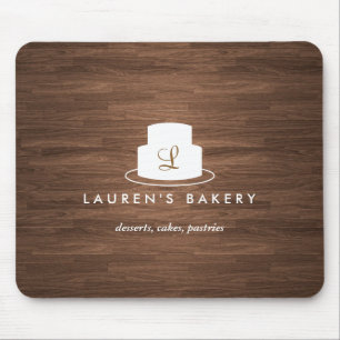 Tapis De Souris Logo Monogramme de gâteau en blanc sur le bois Bro