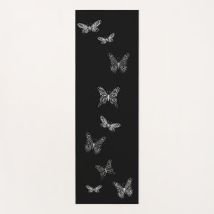 Tapis noir de flottement de yoga de papillons
