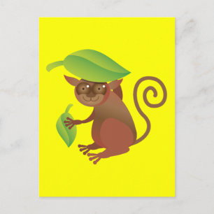 Tarsier hiding under a green leaf postcard