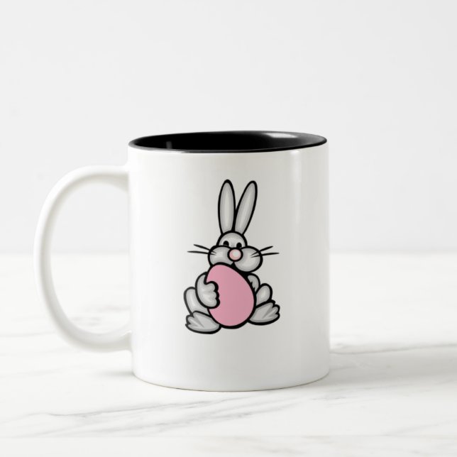 Tasse 2 Couleurs Lapin tenant un oeuf rose-clair (Gauche)