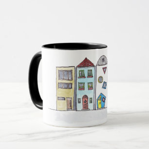Tasse avec des maisons urbaines