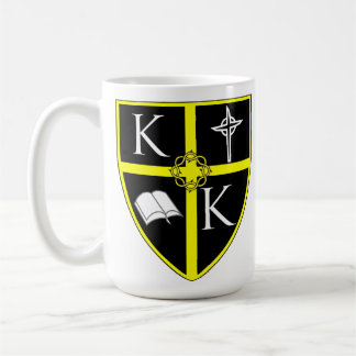 Tasse blanche classique de bouclier