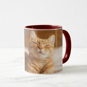 Tasse Chat somnolent des images de Getty