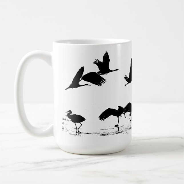 Tasse d'animaux de faune d'oiseaux de grue de (Gauche)