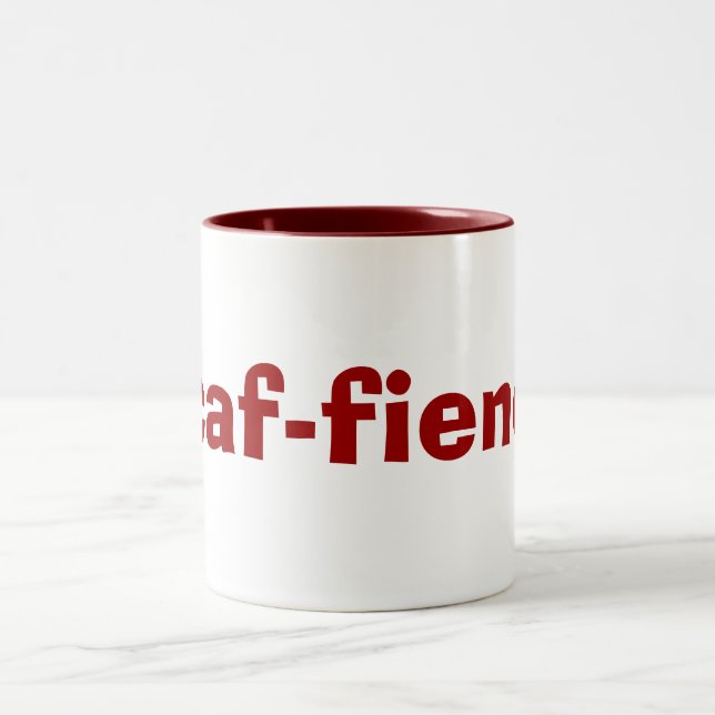 tasse de CAF-démon pour des intoxiqués de café et (Centre)