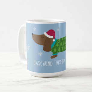 Tasse de café illustrée de teckel dans la neige