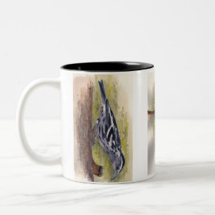 Tasse de café noire et blanche de fauvette