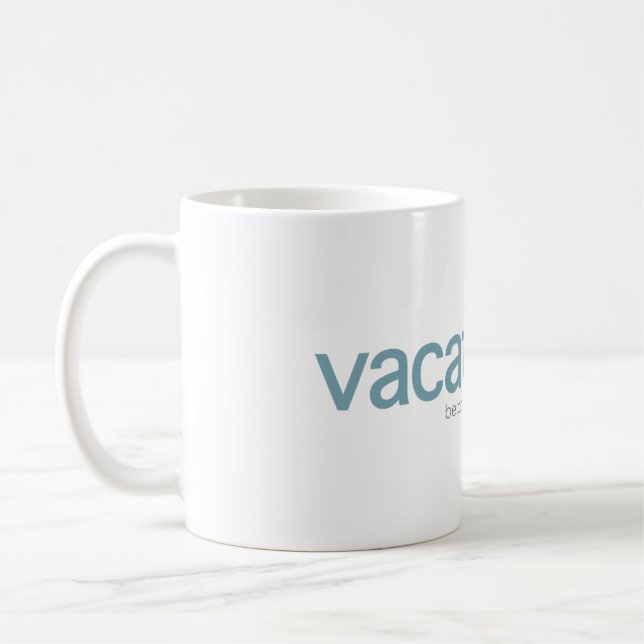 Tasse de logo de Vcom (Gauche)