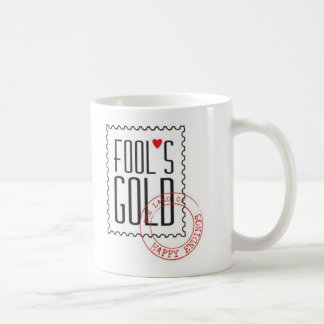 Tasse de l'or de l'imbécile