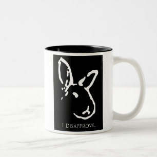 Tasse désapprobatrice noire de lapins