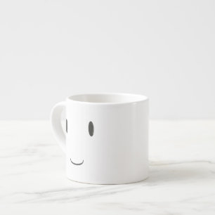 Tasse double-faite face de sourire heureuse