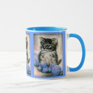 Tasse mignonne de chaton de tricot