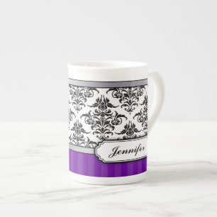 Tasse noire et blanche élégante de porcelaine