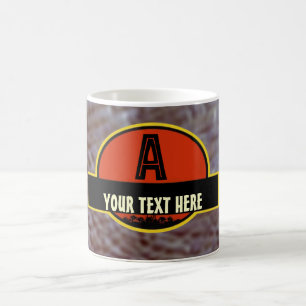 Tasse préhistorique de monogramme de "A"