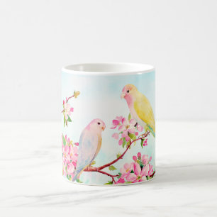 Tasse rose de fleurs et d'inséparables d'aquarelle