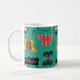 Tasse verte de papillons géométriques