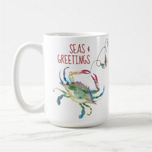 Tasses de café de Noël sur la plage avec crabe