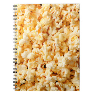 Tasty popcorn on whole background. Food  Notebook