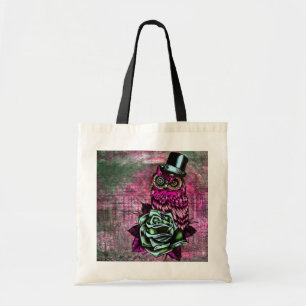 Tattoo style owl with top hat in pink and green tote bag