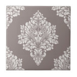 Taupe and Cream Damask Tile<br><div class="desc">A light taupe damask pattern on a darker taupe background creates this striking ceramic tile design. Beautiful for a kitchen backsplash, bathroom tub, shower and countertop tile, or any area (not for outdoor use.) MATCHING items in our store.</div>