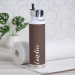 Taupe Personalized Wedding Bridesmaid Water Bottle<br><div class="desc">Gift your wedding bridesmaid or maid of honour with this trendy, vacuum Insulated water bottle that features her name in white, stylized script on a taupe colour background designed to match your wedding colour scheme. Personalize bottle by editing and replacing name with your own as desired. Select your water bottle...</div>